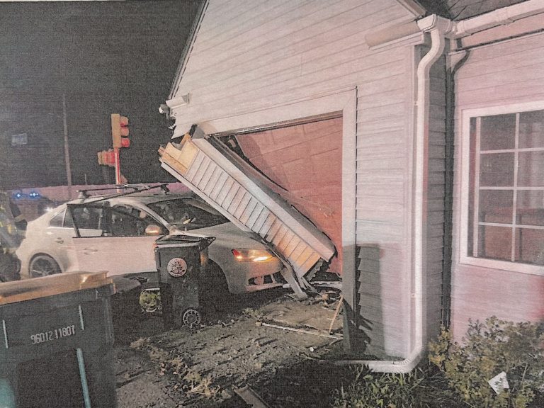 Driver hospitalized after car crashes into Attleboro Falls garage